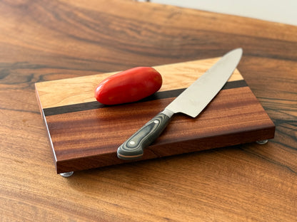 Handmade maple, sapele, black palm mini wood cutting board
