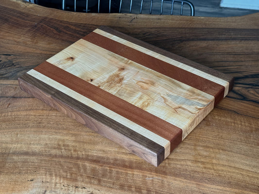 handmade black walnut, sapele and maple wood cutting board