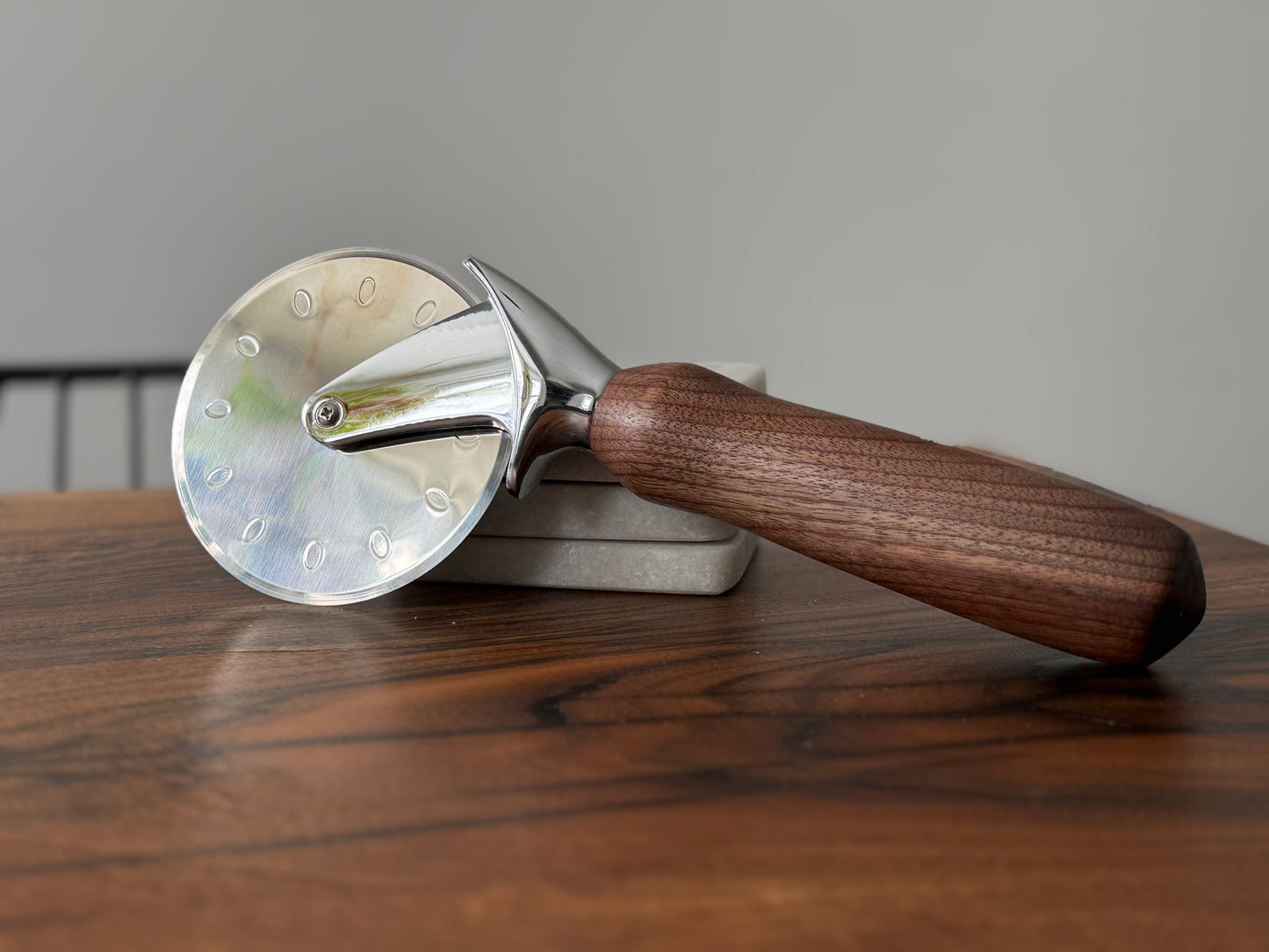 Handmade black walnut pizza cutter