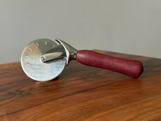 Handmade purple heart pizza cutter